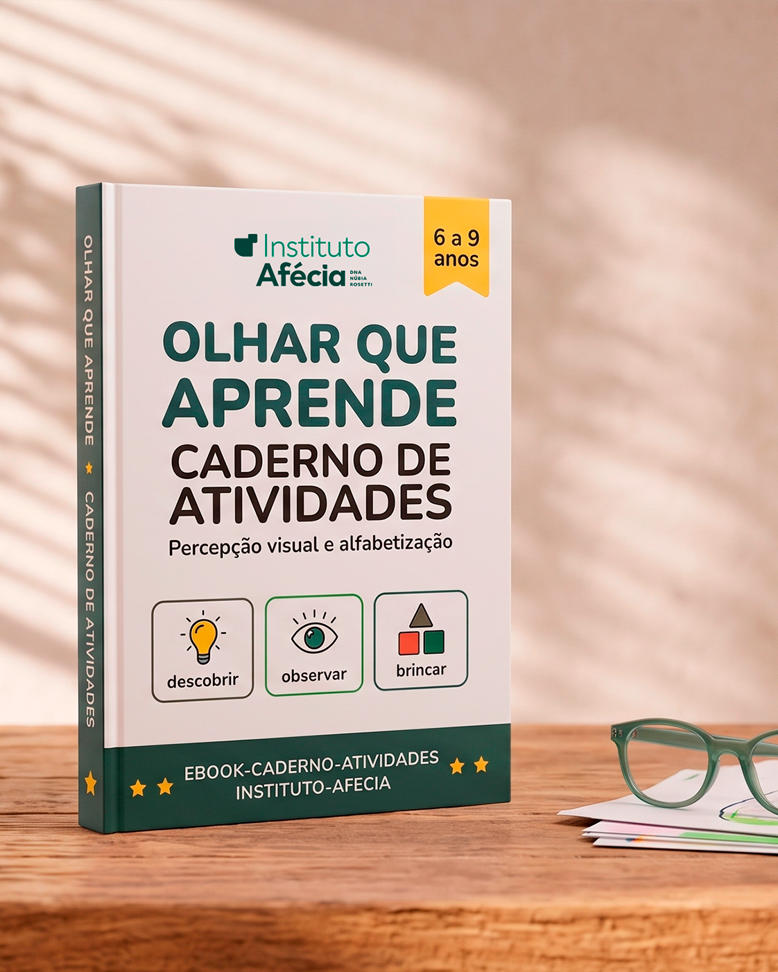 Caderno de atividades do Instituto Afécia aberto sobre a mesa